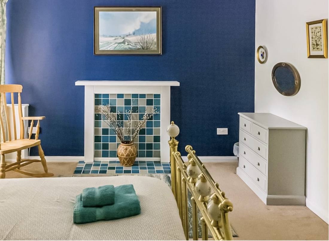 Feature bedroom with fireplace