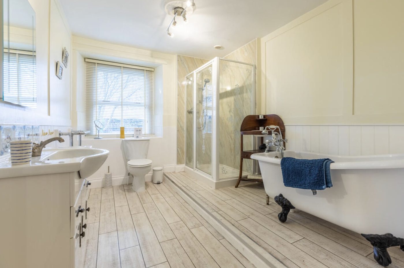 The Rockery family bathroom with roll-top bath and separate shower